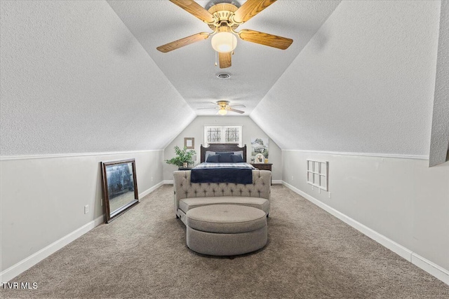 unfurnished bedroom with lofted ceiling, carpet flooring, baseboards, and a textured ceiling