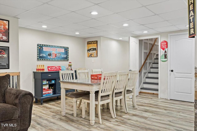 dining area featuring stairs, light wood-style flooring, and recessed lighting