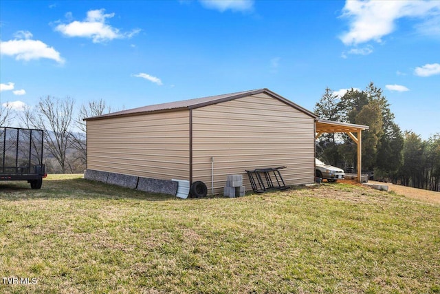 view of home's exterior featuring an outbuilding and a lawn