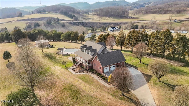 aerial view with a mountain view and a rural view