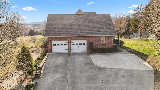 view of home's exterior with brick siding, a garage, roof with shingles, and a lawn