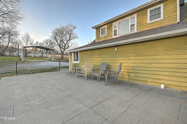 view of patio featuring fence