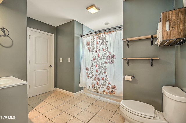 bathroom with tile patterned floors, curtained shower, toilet, and vanity