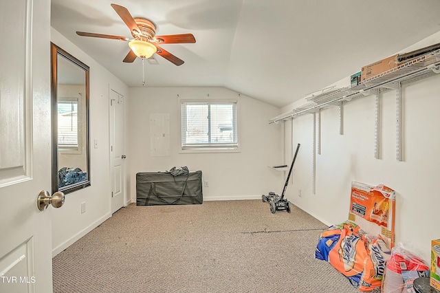 recreation room with carpet flooring, baseboards, a ceiling fan, and vaulted ceiling