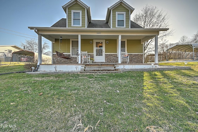 view of front facade featuring stone siding, a carport, a porch, and a front yard