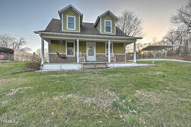 new england style home with a carport, stone siding, and a porch