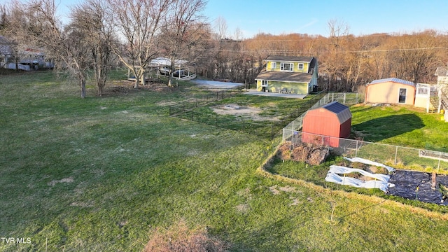 view of yard with an outdoor structure and fence