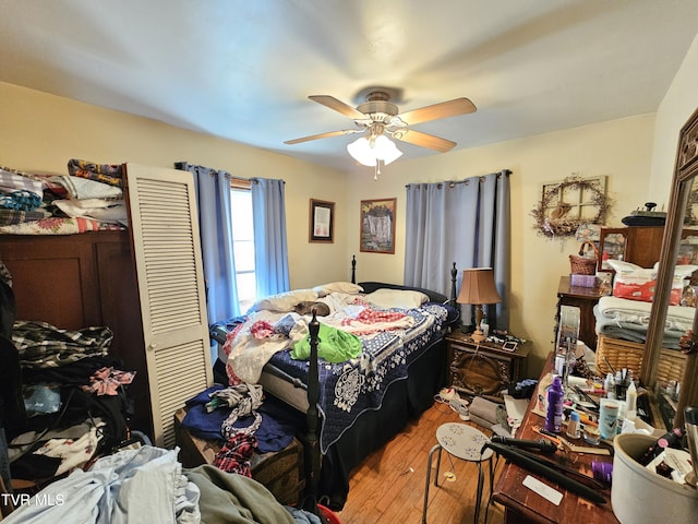 bedroom featuring light wood-type flooring and ceiling fan