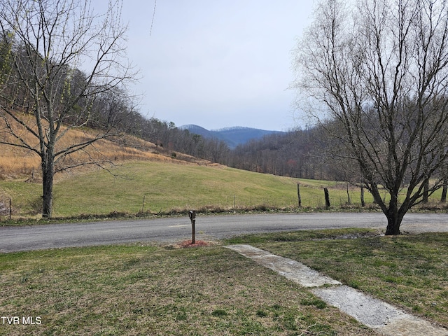 view of street featuring a rural view and a mountain view