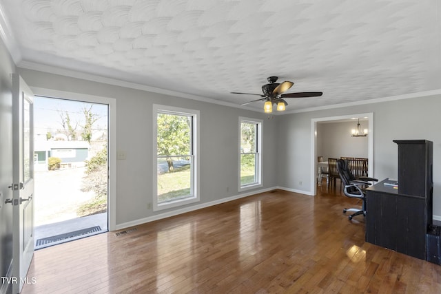 home office featuring visible vents, baseboards, wood-type flooring, and ornamental molding