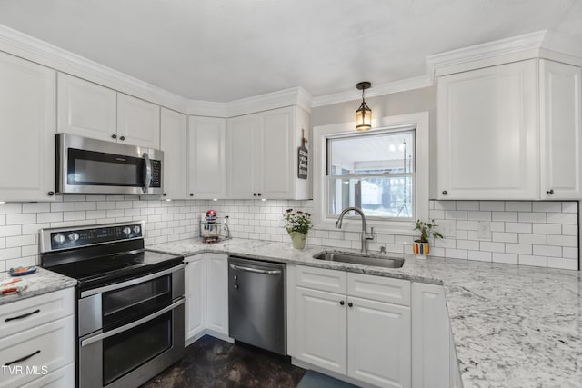 kitchen with a sink, white cabinets, and stainless steel appliances