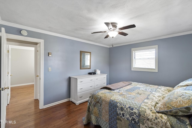 bedroom with ornamental molding, a ceiling fan, baseboards, and dark wood-style flooring