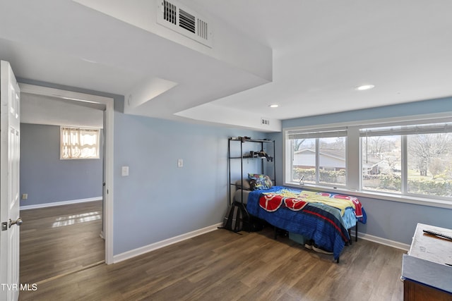 bedroom featuring visible vents, recessed lighting, baseboards, and wood finished floors