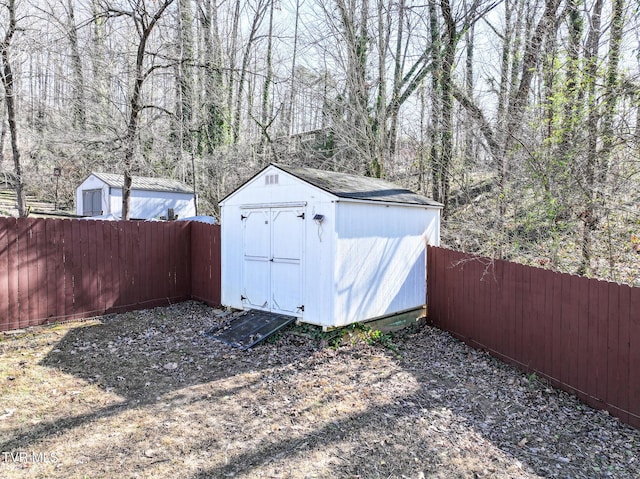 view of shed with a fenced backyard