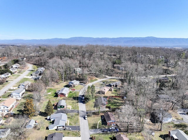 bird's eye view with a mountain view and a wooded view