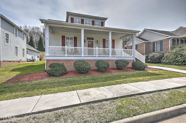 bungalow-style house featuring a front yard and covered porch