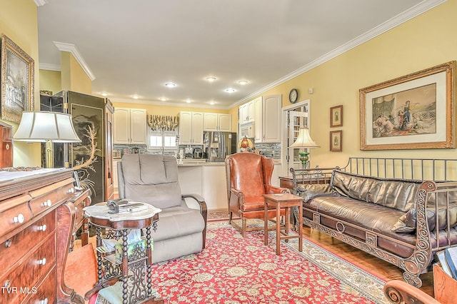 living room with crown molding and light wood-style flooring