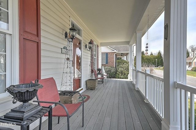 wooden terrace with a porch