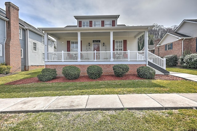 bungalow-style house featuring a porch and a front lawn