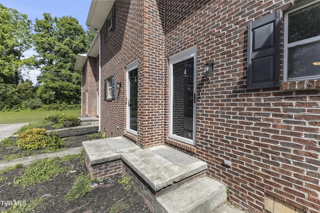 exterior space featuring brick siding