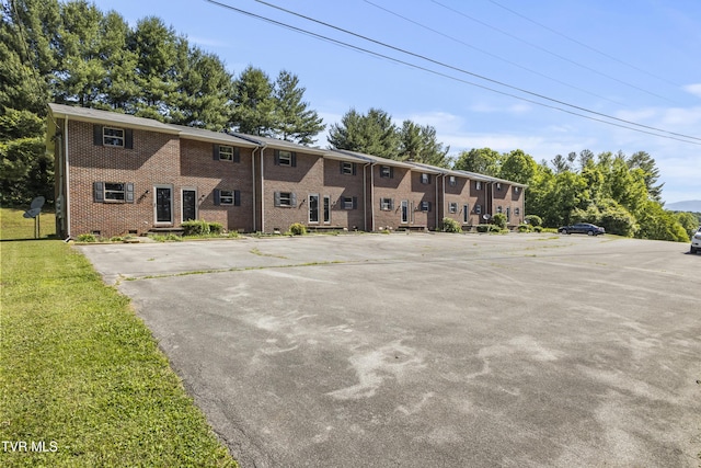 view of property with uncovered parking