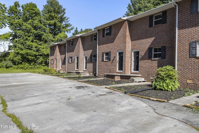 exterior space featuring brick siding