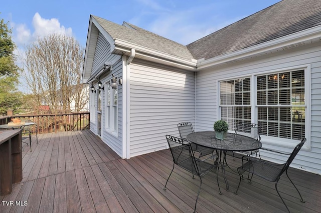 deck with outdoor dining area