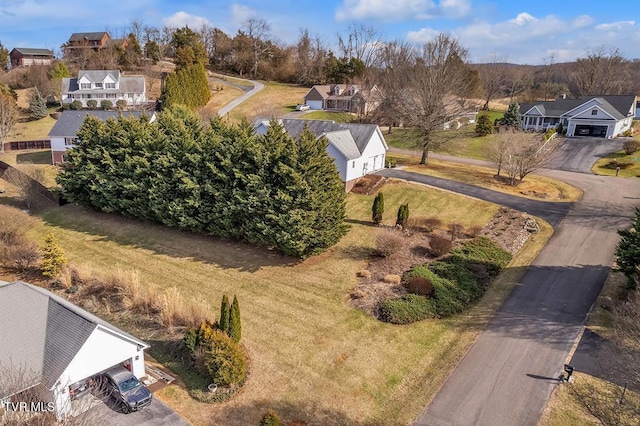 birds eye view of property with a residential view