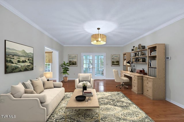 living area with a wealth of natural light, french doors, baseboards, and wood finished floors