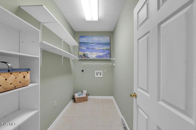 laundry room with electric dryer hookup, baseboards, washer hookup, and laundry area