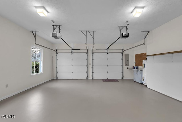 garage featuring electric panel, a garage door opener, and baseboards