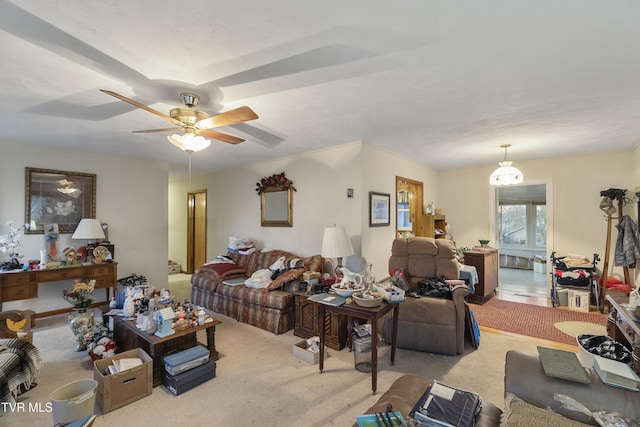 living area featuring a ceiling fan and carpet