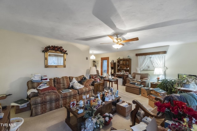 living area featuring ceiling fan and light carpet