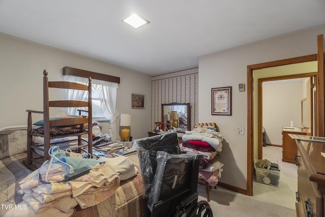 bedroom featuring baseboards and light colored carpet