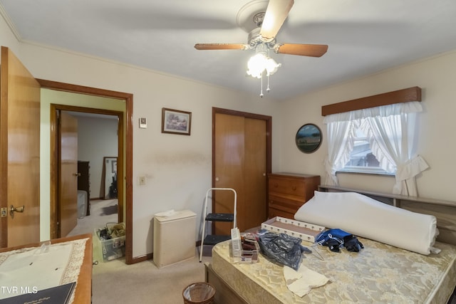 bedroom with ceiling fan, baseboards, and light carpet