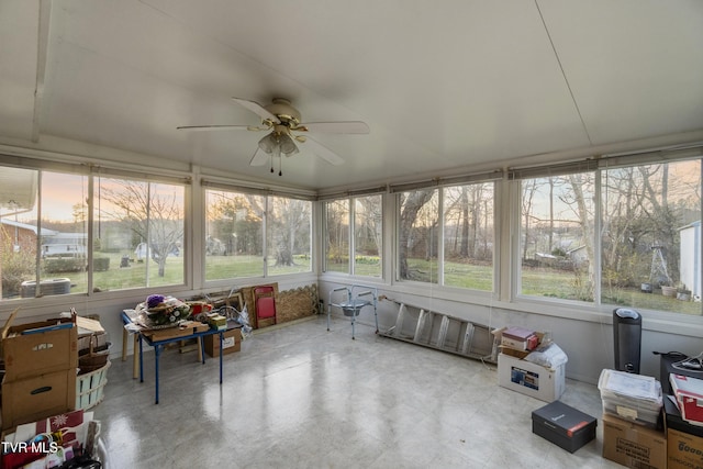 sunroom featuring ceiling fan