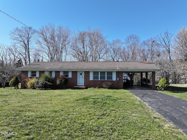 ranch-style home featuring driveway, a carport, brick siding, and a front yard