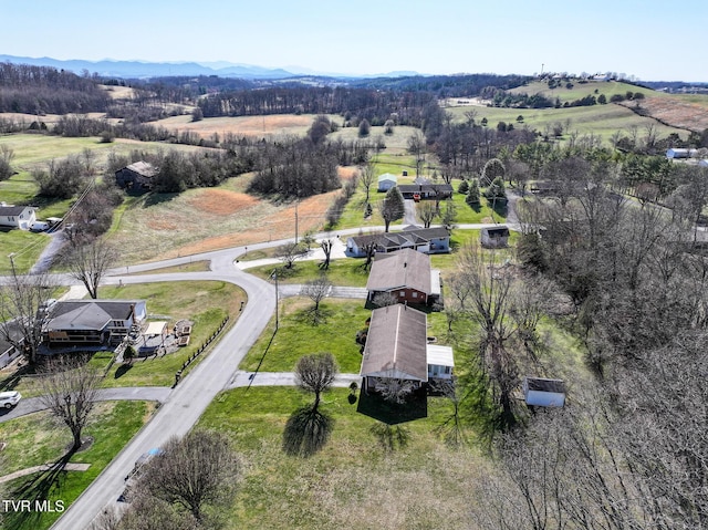 bird's eye view featuring a rural view and a mountain view