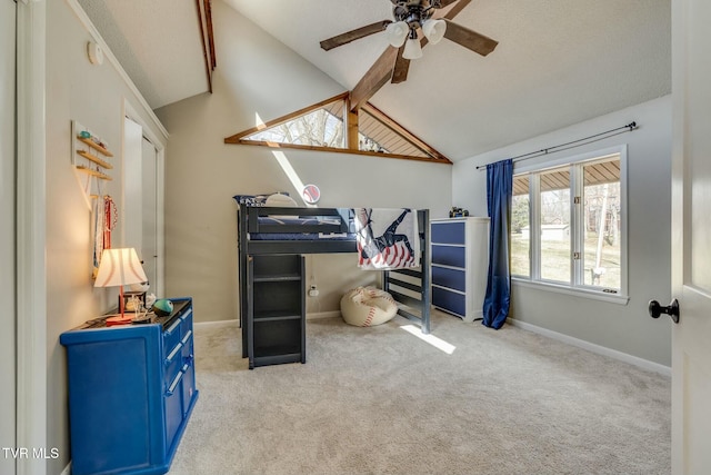 carpeted bedroom featuring baseboards and lofted ceiling