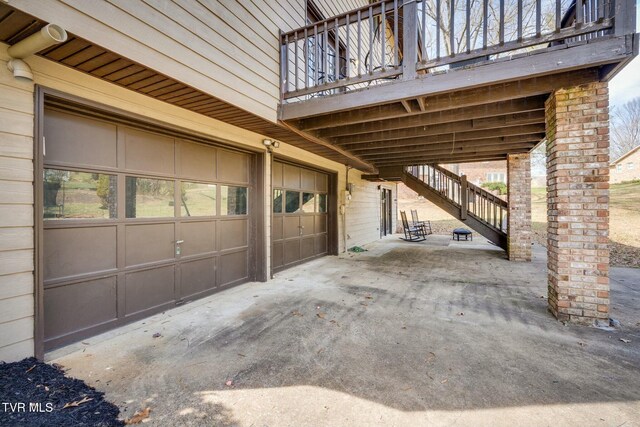 exterior space featuring stairway and an attached garage