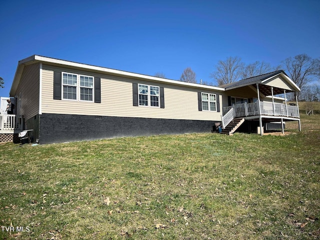 view of front of house with crawl space, a front yard, and stairway