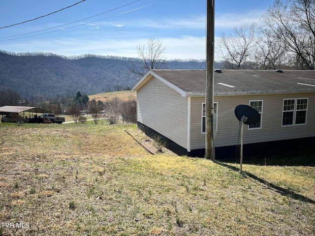 view of side of home featuring a mountain view