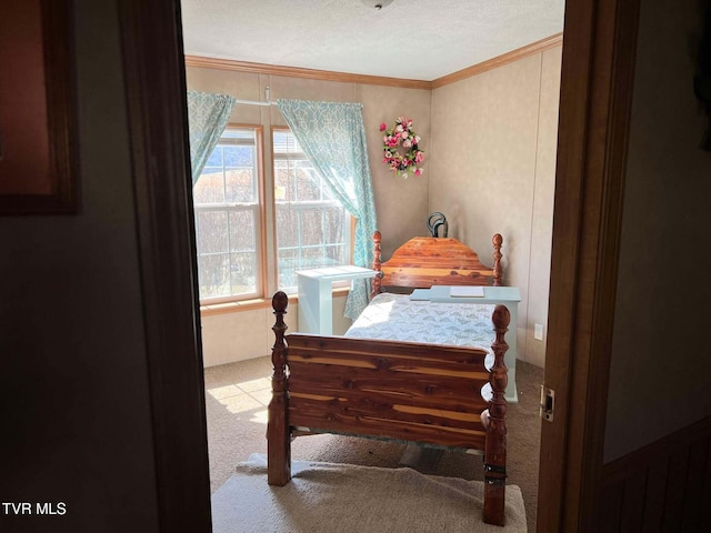 carpeted bedroom featuring crown molding