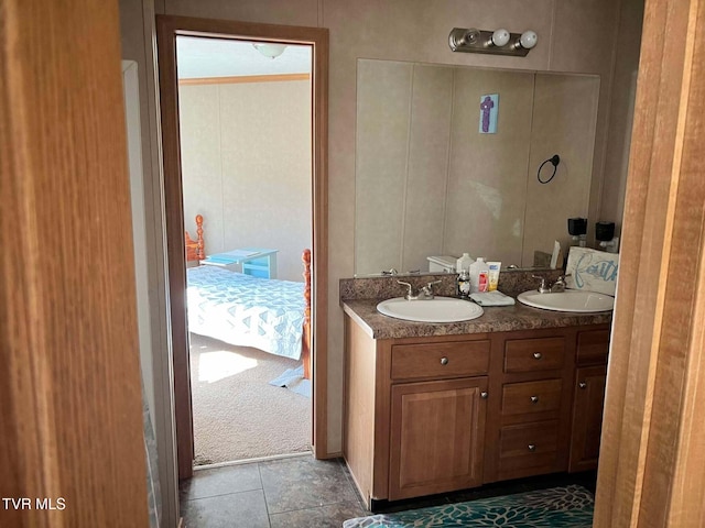 bathroom with a sink and double vanity