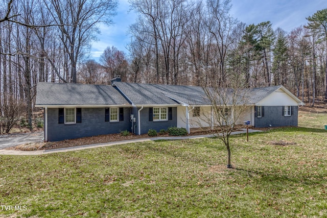 single story home with a shingled roof, a front lawn, and a chimney