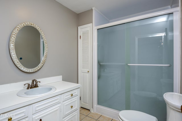 full bathroom with toilet, a stall shower, vanity, and tile patterned flooring