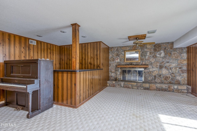 interior space with visible vents and wooden walls