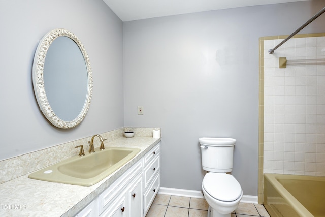 bathroom with toilet, tile patterned flooring, baseboards, bathing tub / shower combination, and vanity