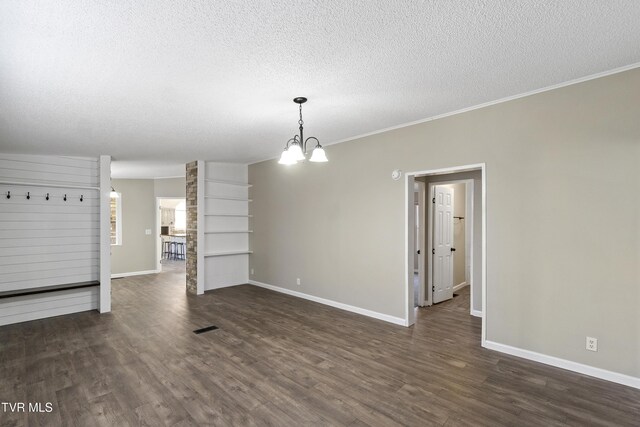 interior space featuring baseboards, a notable chandelier, dark wood-style flooring, and a textured ceiling