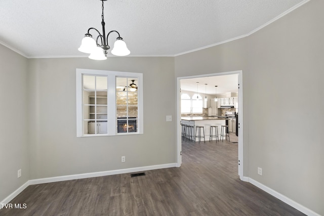 unfurnished dining area featuring a notable chandelier, baseboards, dark wood-type flooring, and visible vents